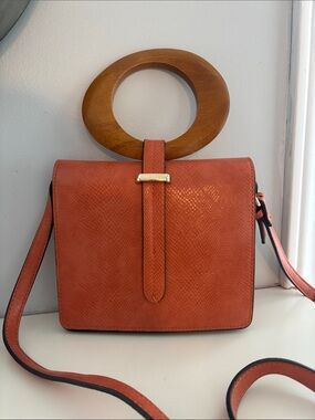 Moda Luxe soft Orange Textured Crossbody Bag with Gold Accent and wood handle